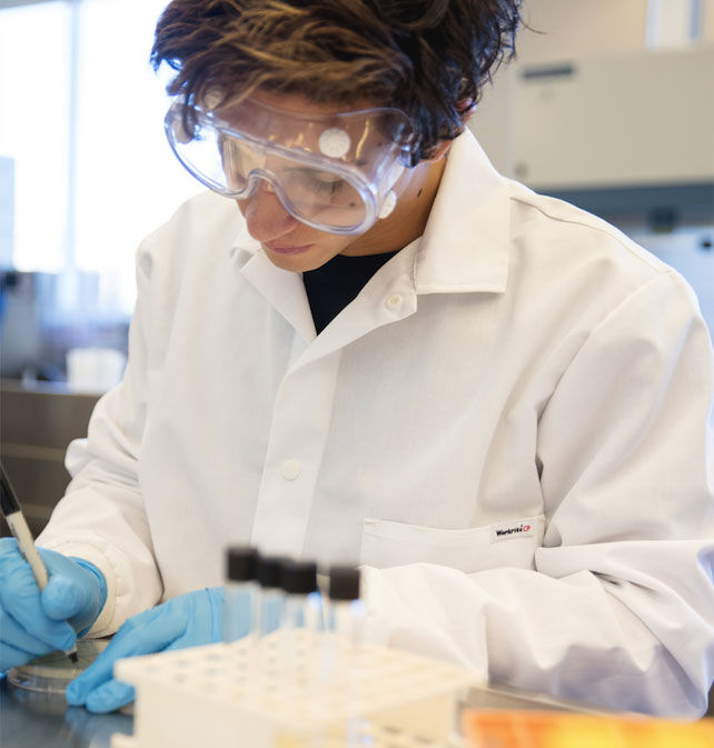 A Man Wearing A White Lab Coat