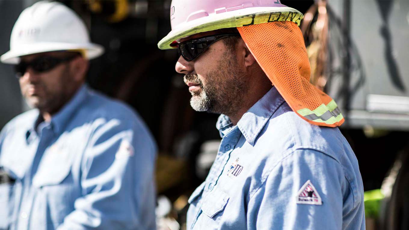 Two Workers With Hard Hats